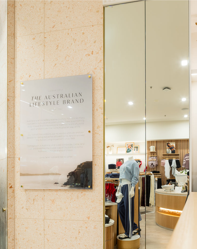 Lorna Jane store interior with a wall plaque reading 
