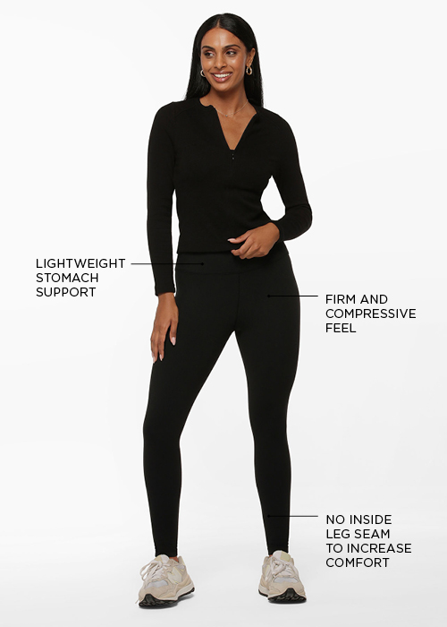 woman wearing a black top and black thermal leggings
