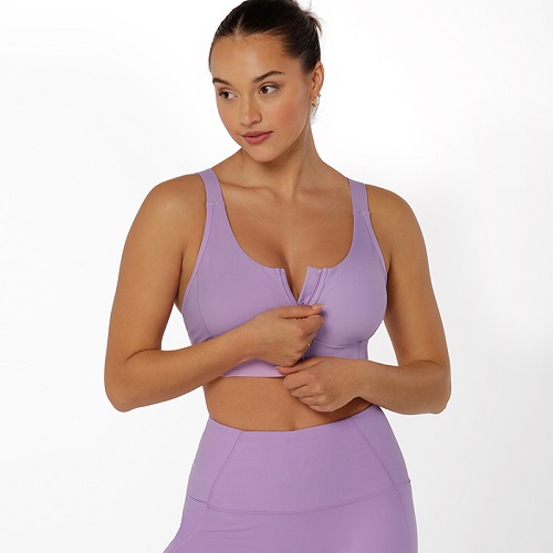 brunette woman wearing the best high impact sports bra lilac purple zip front closure sports bra