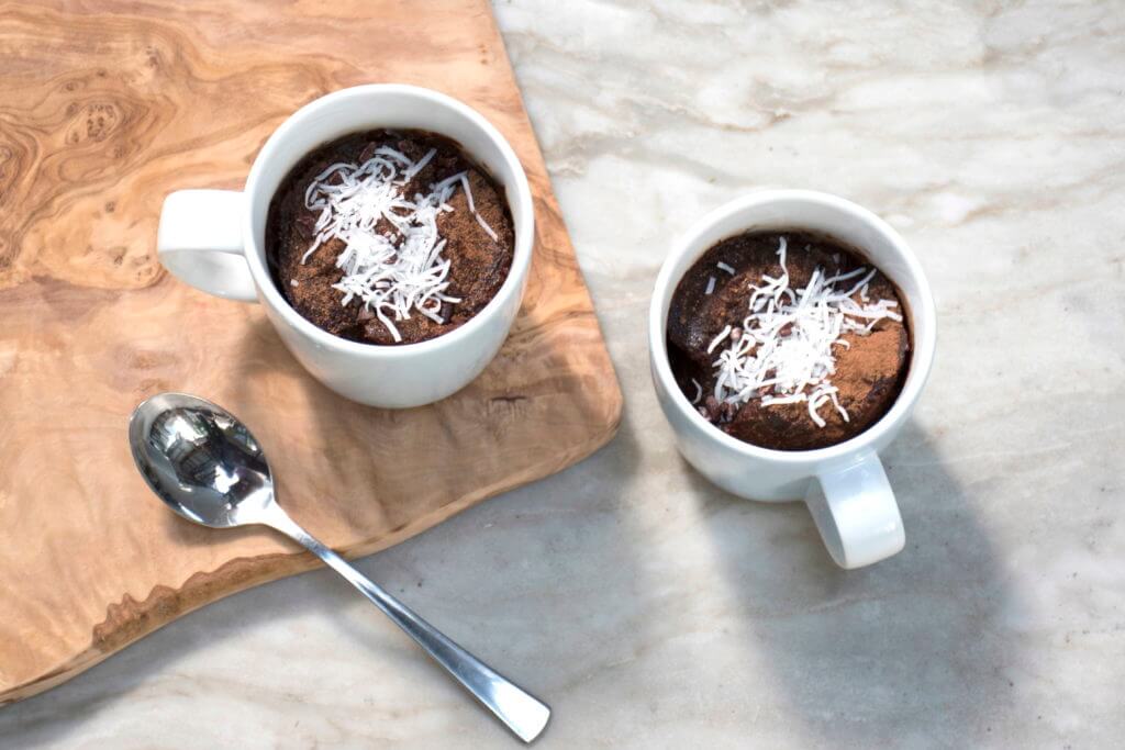 two mugs full with healthy chocolate puddings